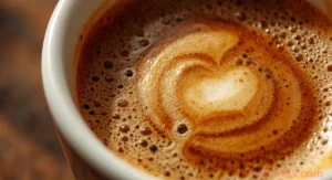 Cup of black coffee with lemon, cinnamon, and MCT oil for weight loss
