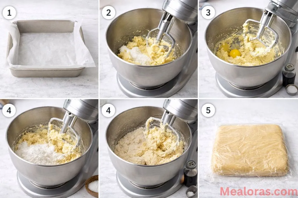 A stand mixer bowl containing creamed butter and sugar being mixed into a soft cookie dough base
