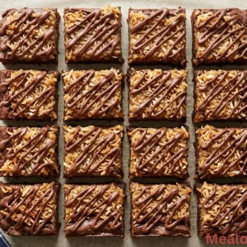 of sliced Samoa brownies with toasted coconut and chocolate drizzle