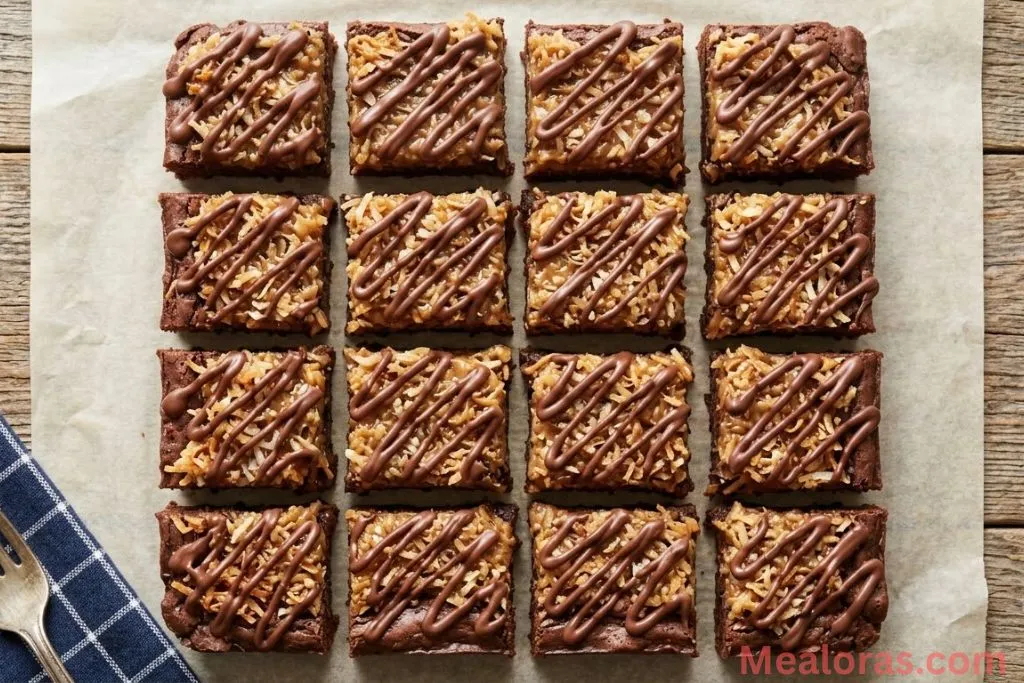 of sliced Samoa brownies with toasted coconut and chocolate drizzle