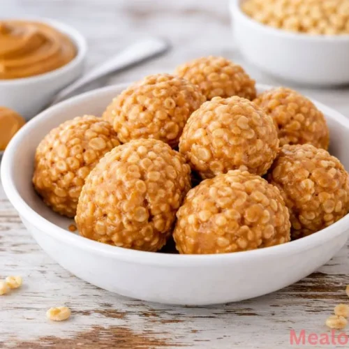 A bowl of golden rice crispy peanut butter balls