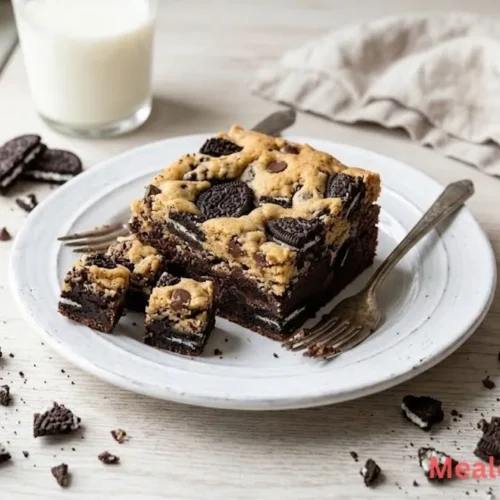 Overlapping squares of Oreo brookies showing fudgy brownie and golden cookie layers